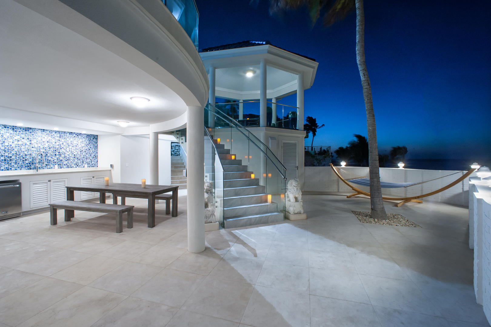 Walk down the stairs to the lower deck to hang poolside.