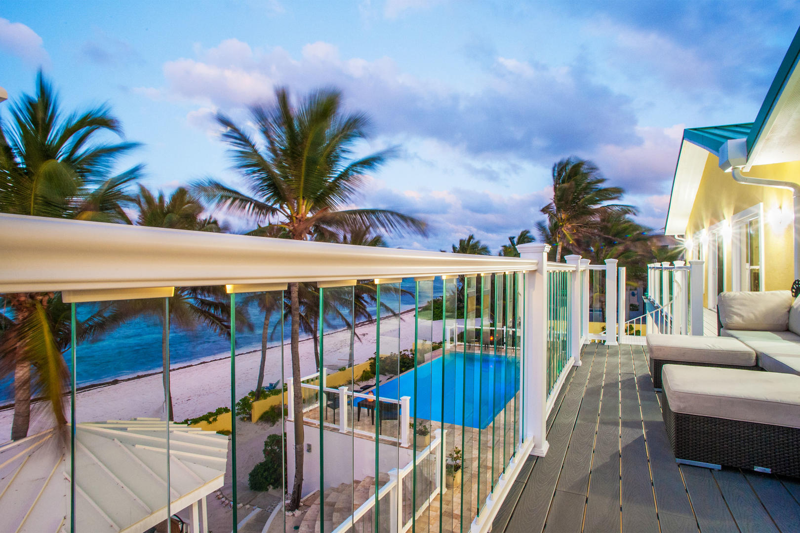 Stunning balcony with cozy couches to watch the sun go down.