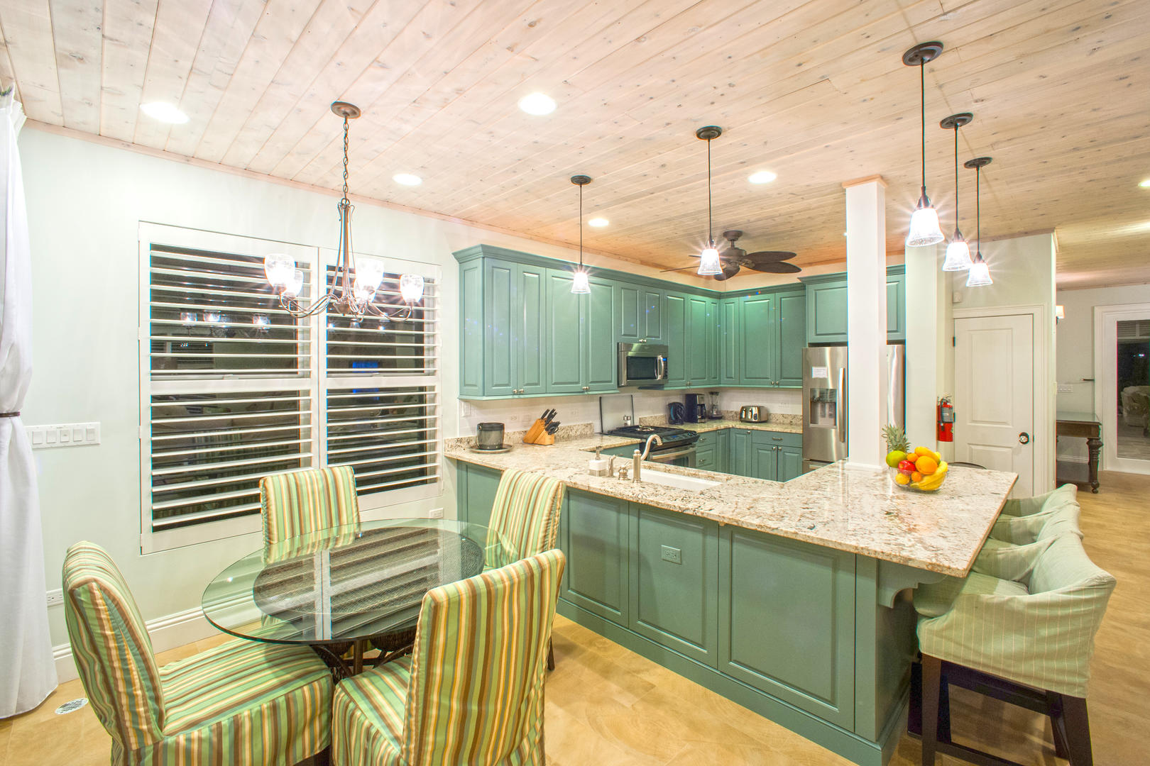 Bright kitchen with modern appliances and gorgeous ocean views.