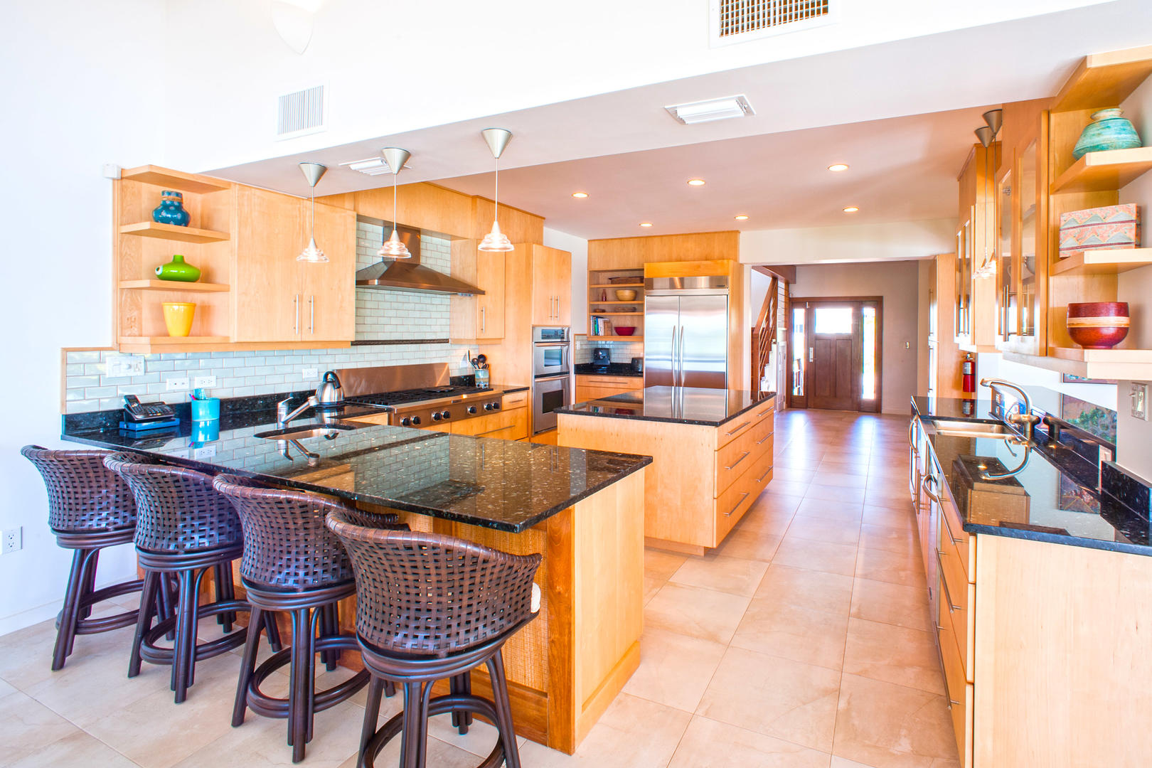 The large kitchen features a breakfast bar with seats for 4.
