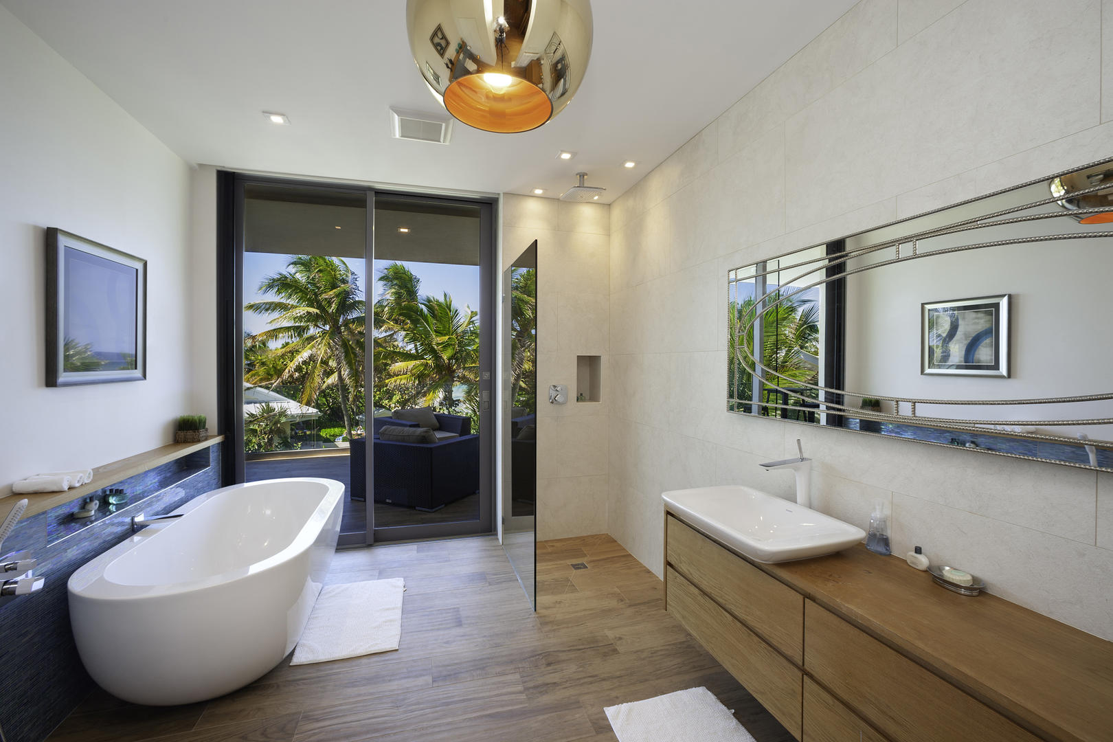 Master king suite bathroom with tub and rain shower. Also has access to west terrace.	