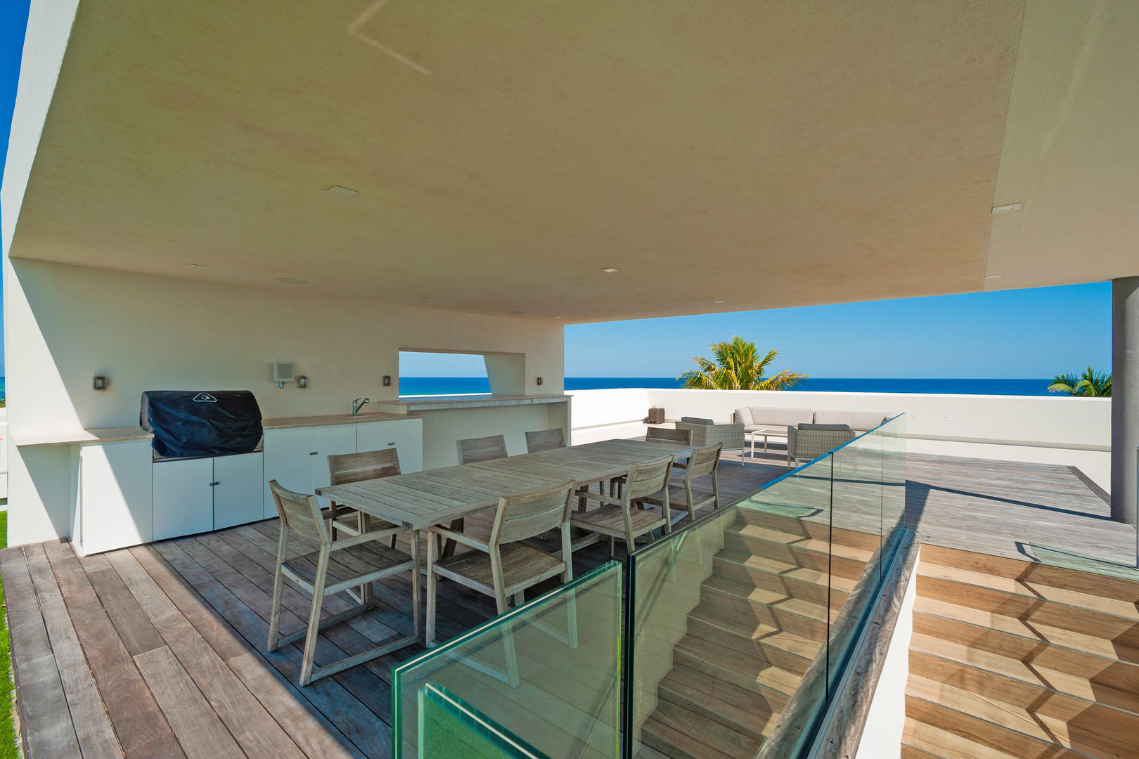 Rooftop kitchen with gas grill and amazing island views.