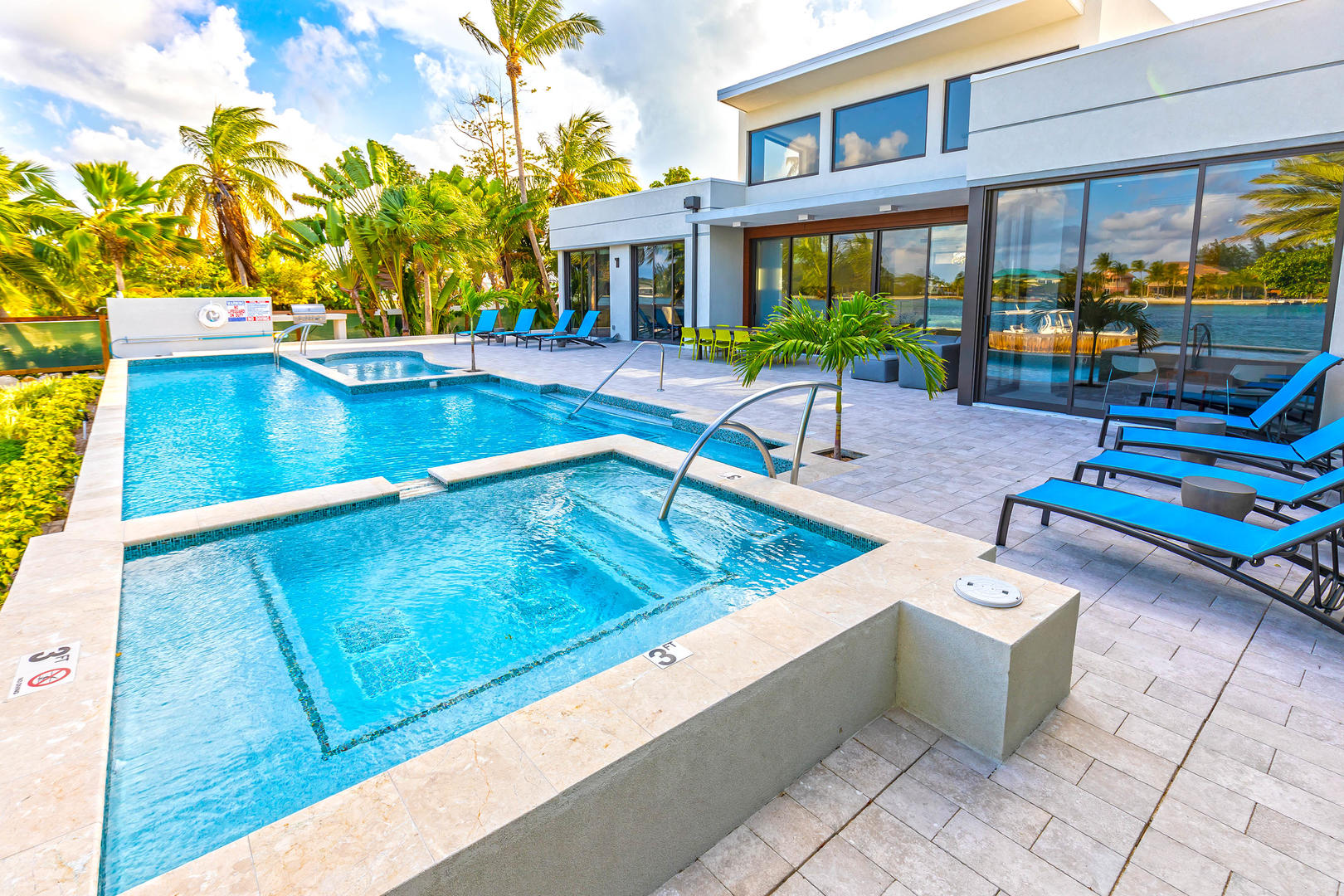 Welcome to White Dahlia! This backyard oasis features a pool with heated spa and separate toddler splash area.