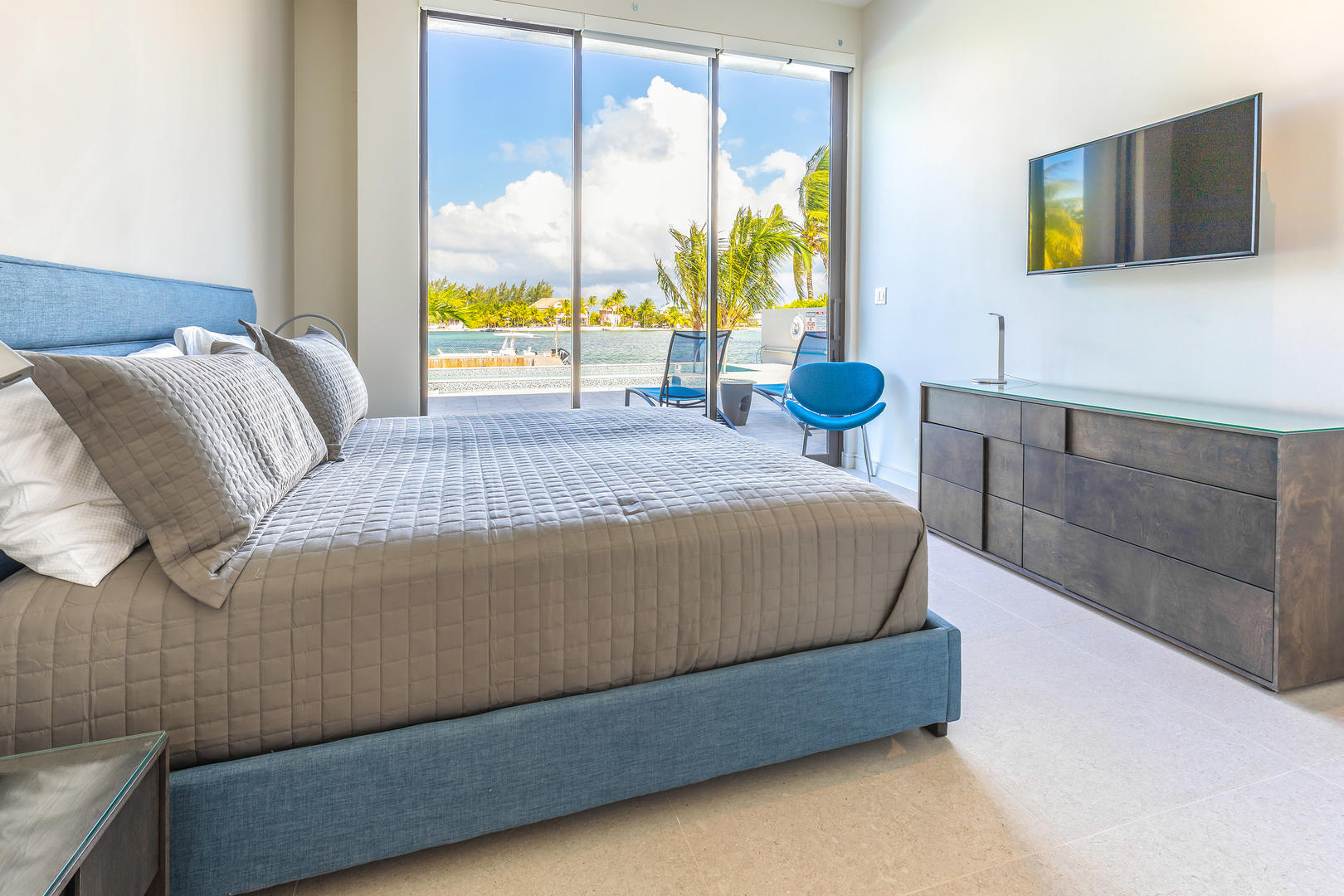 Guest suite #2 is identical to the other guest suite with king bed, TV, and pool deck access.