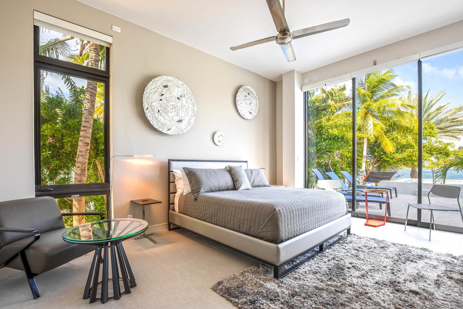 The master suite comes furnished with a king bed and direct access to the spa and pool.