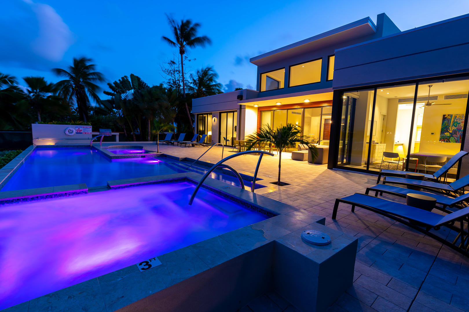 LED lights make the pool and spa glow at night.