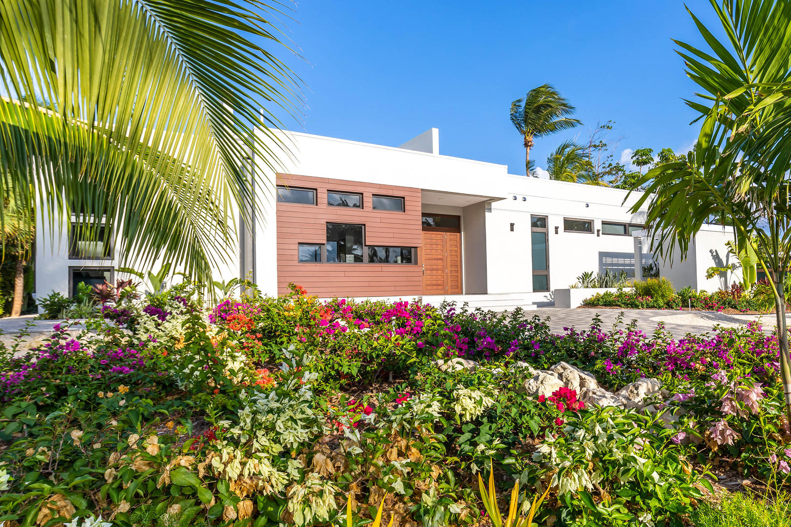 Lush tropical plants greet you at the front of the villa.