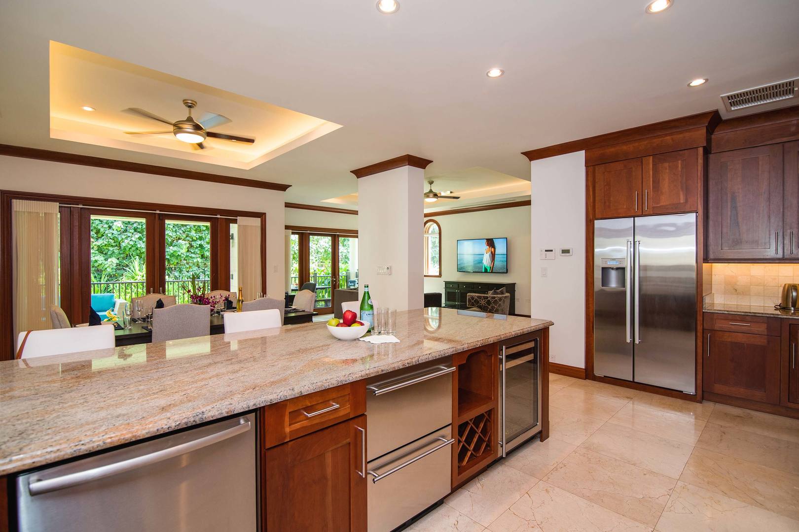 Open concept floor plan with kitchen overlooking the living and dining areas.