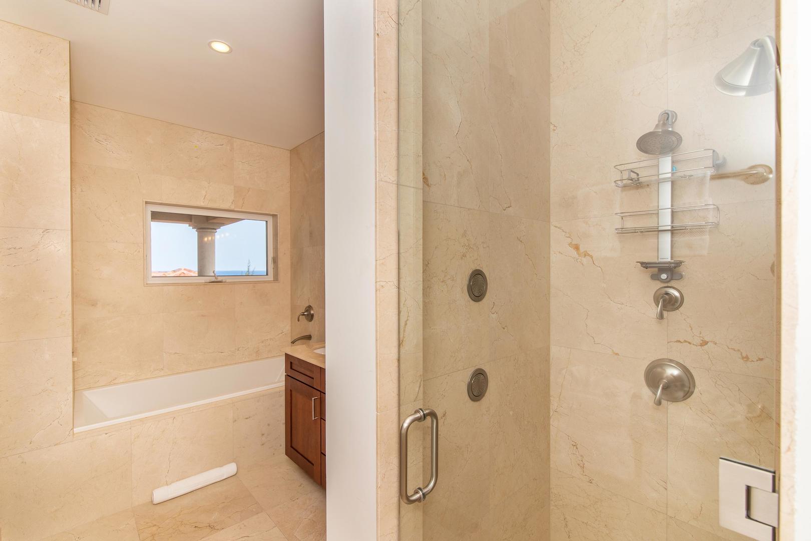 Separate shower and tub in the background.