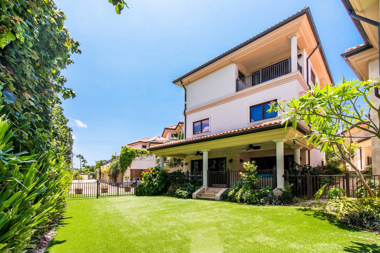 Private side yard with steps leading to the veranda.