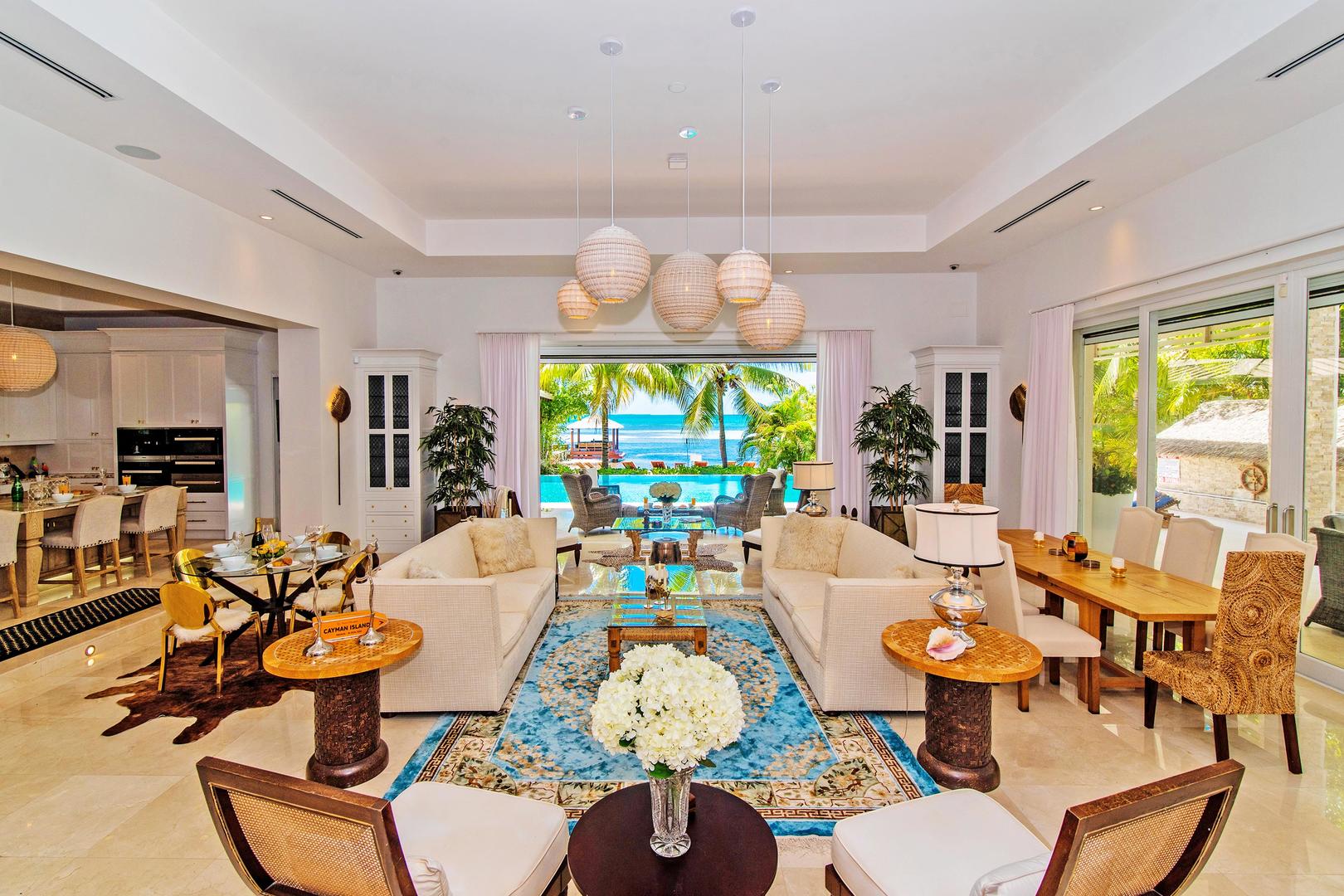 Lounge around this opulent living room with stunning seaside views.