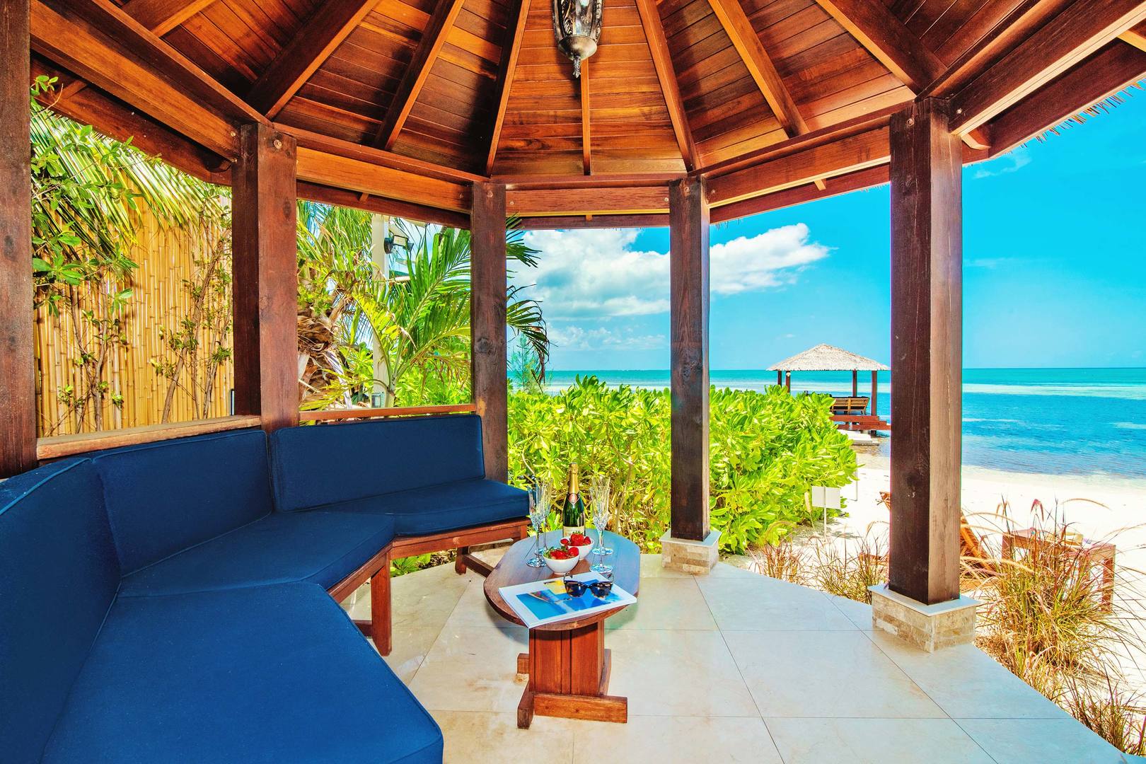 Enjoy some shade under the beachside cabana that features stunning views of the Caribbean Sea.