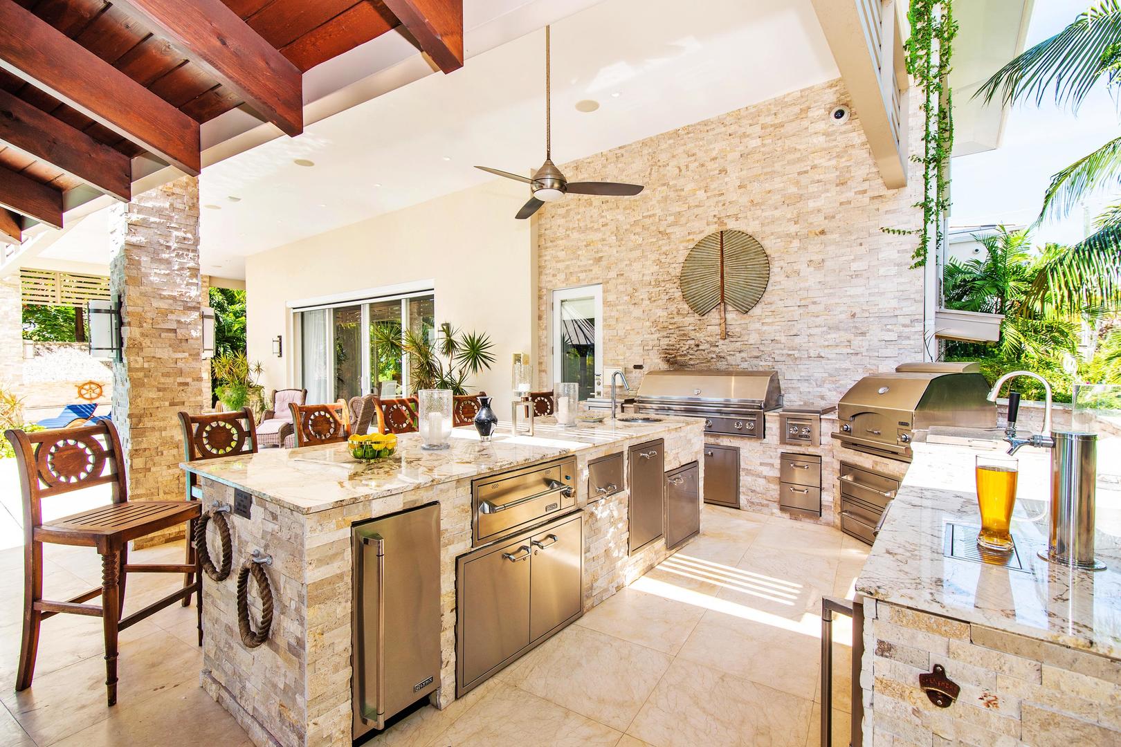 Paradis Sur Mer features a fully-equipped outdoor kitchen with fridges, beverage coolers, kegerator, warming drawers, ice machine, oven, grills, and even an outdoor pizza oven. 