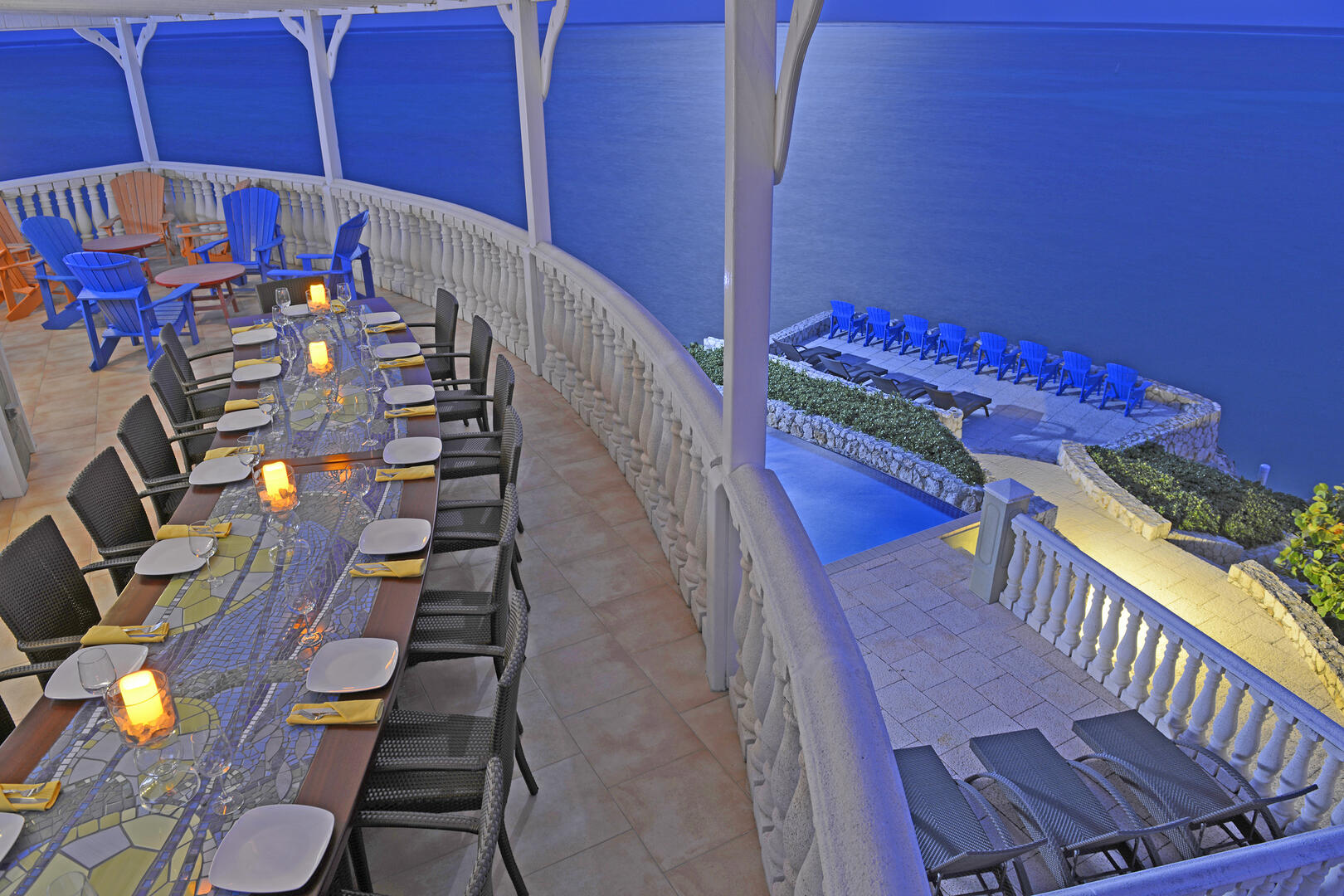Dine al fresco at the custom mosaic table with beautiful views.