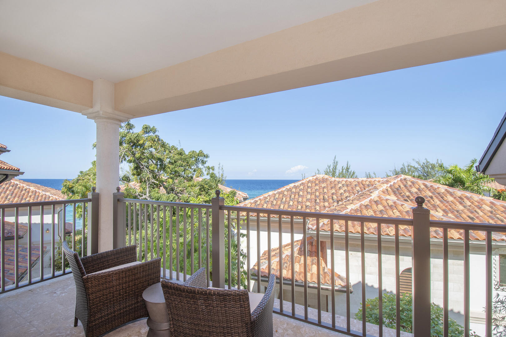 Master suite balcony with patio seating. 