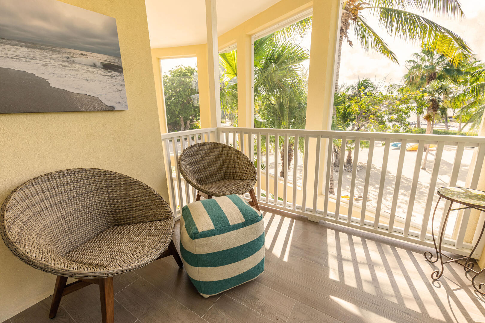 Both bedrooms include a furnished private balcony. 