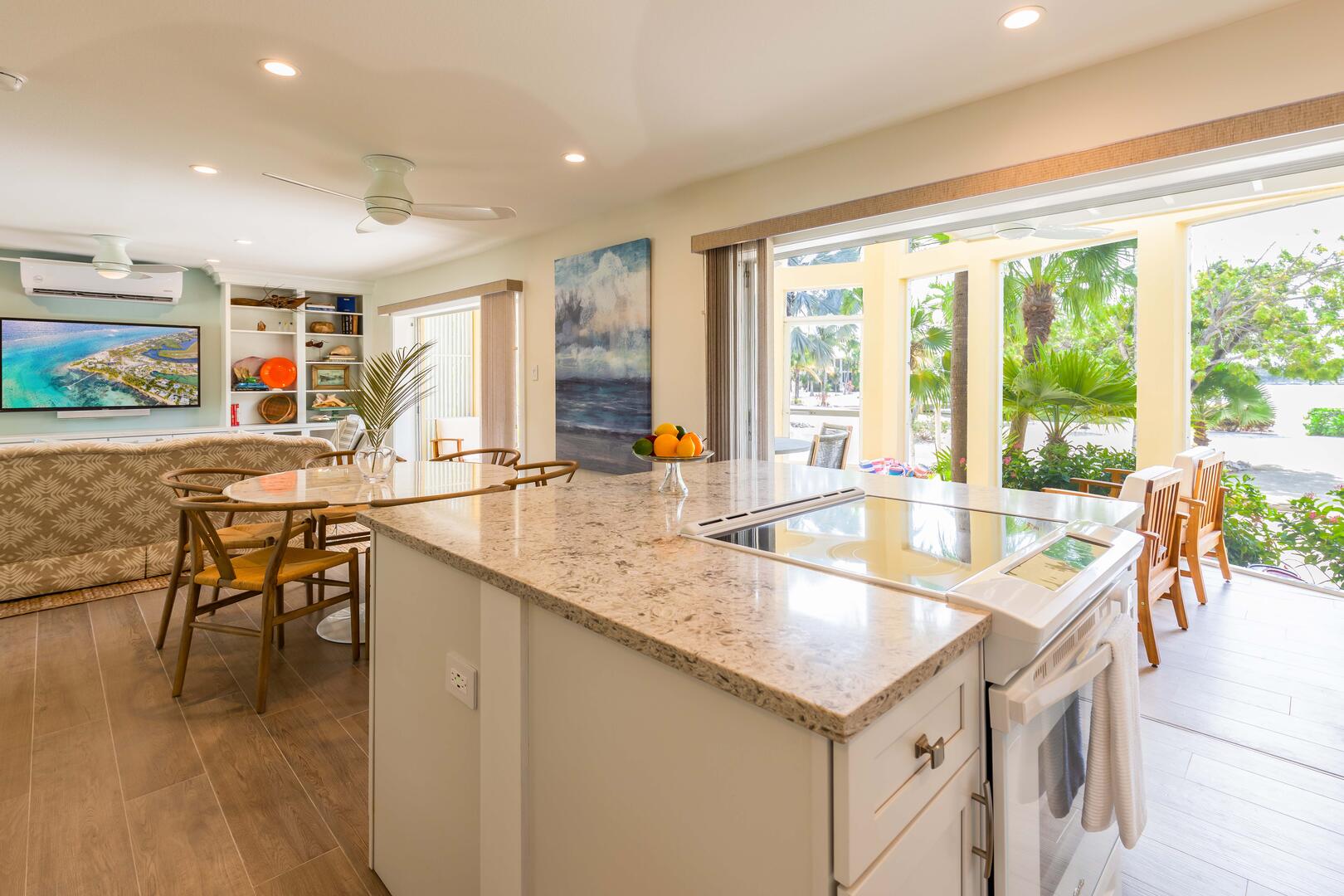 Kitchen overlooks the living area with walk-out access to the screened patio. 