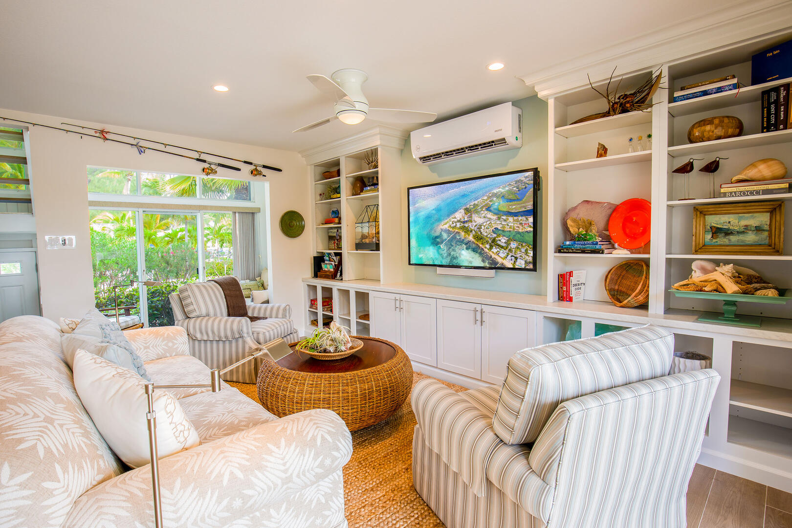 The living area is equipped with a cable HD television, audio sound bar, and mini-split air conditioning. 