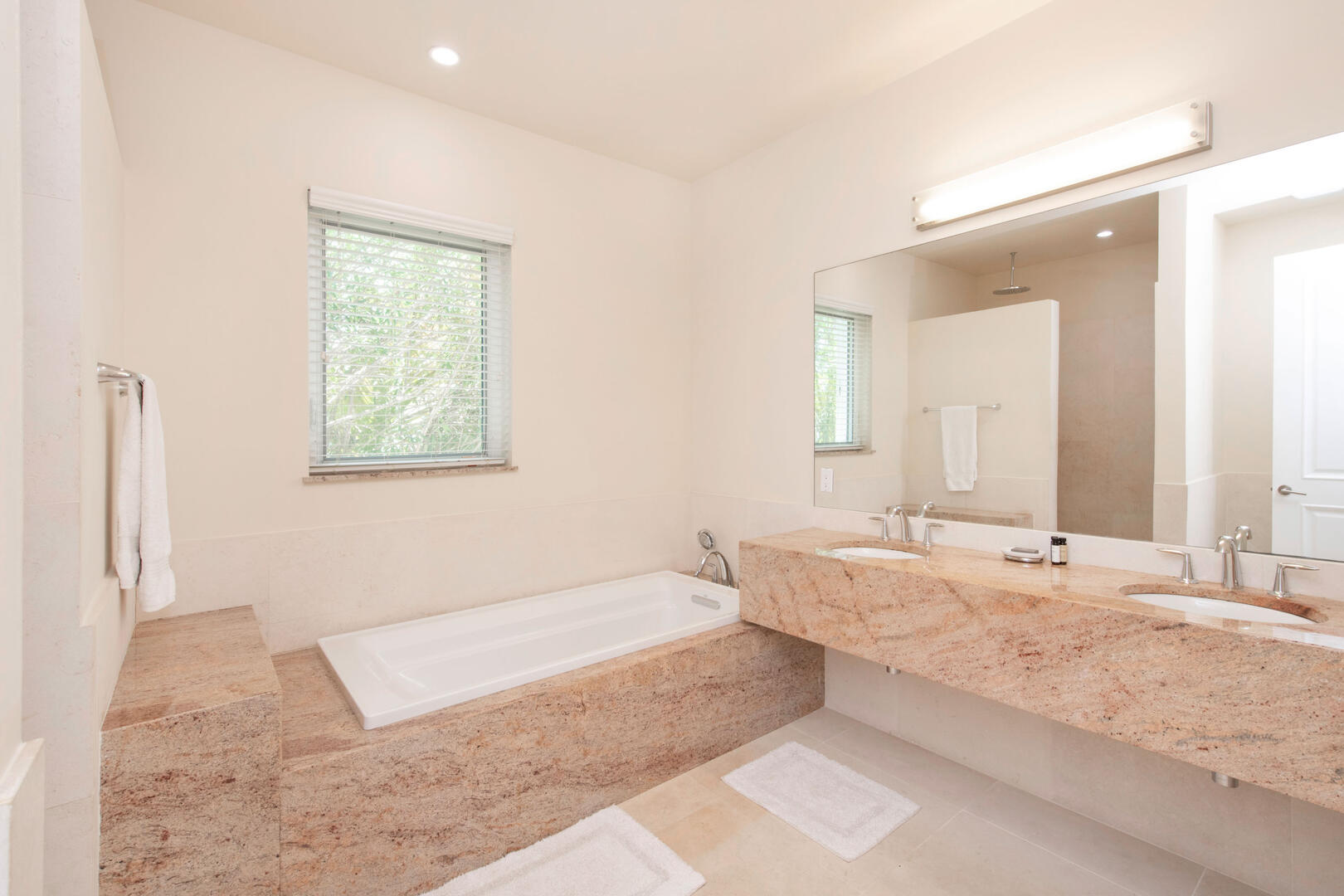 Guest Ensuite #3 with dual vanity, soaking tub, and separate shower.