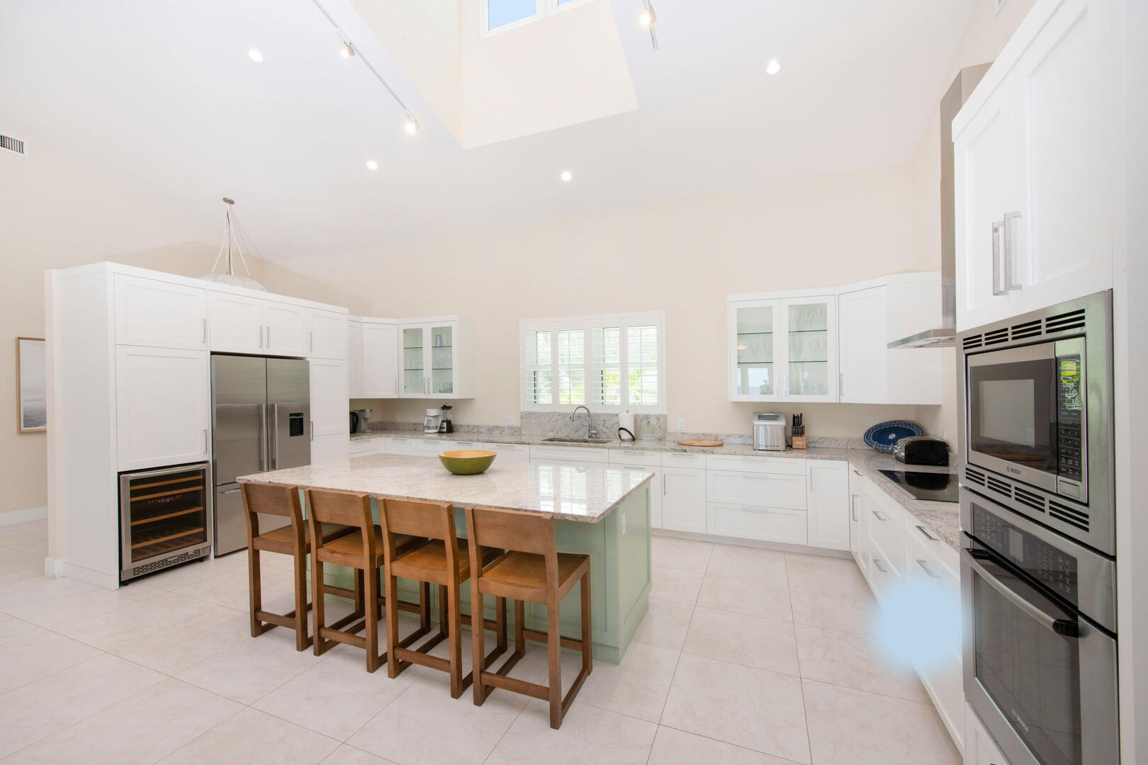 Kitchen with island seating for four plus a new wine fridge. 