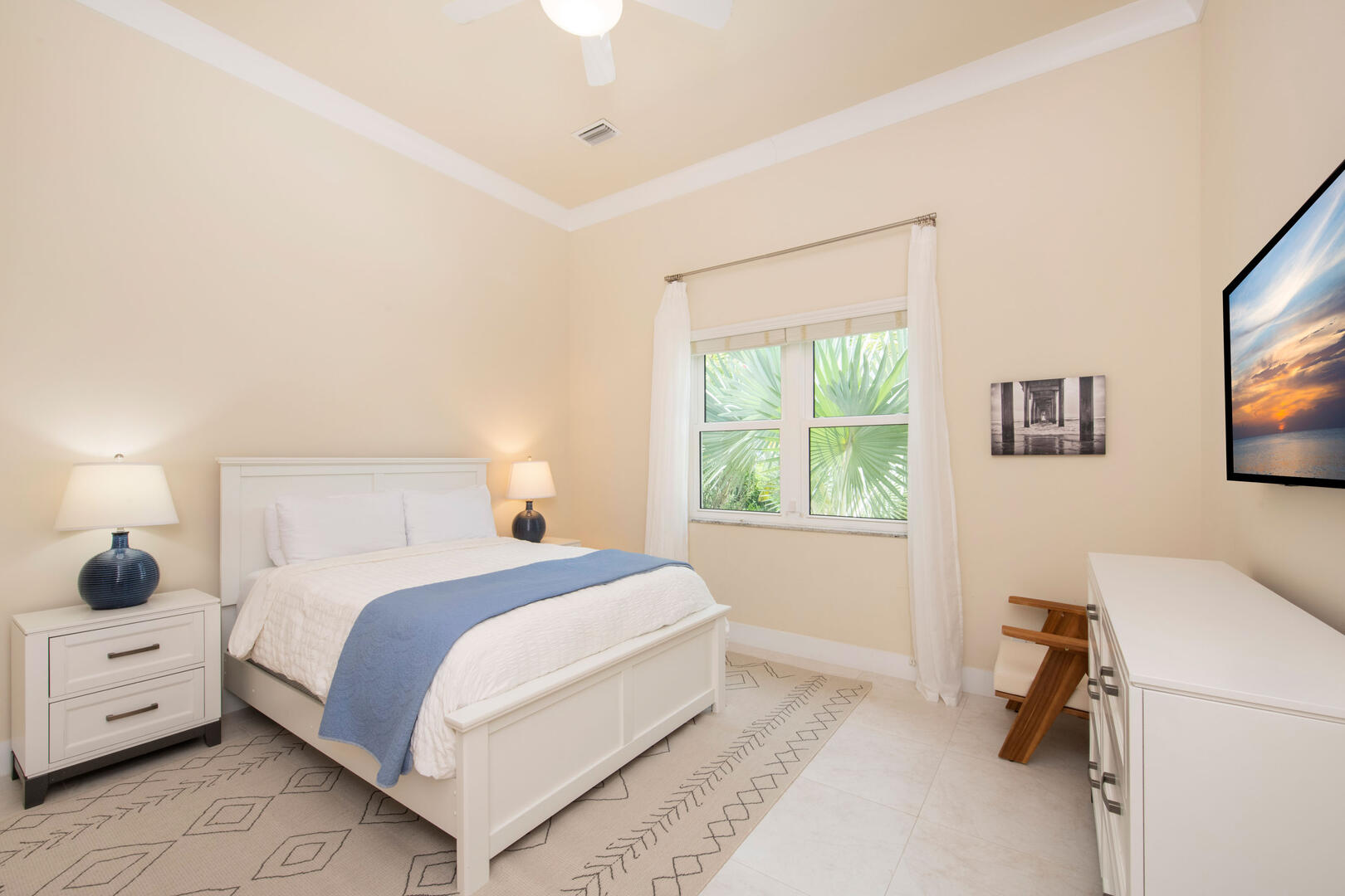 Guest Suite #4 with queen bed and television. 