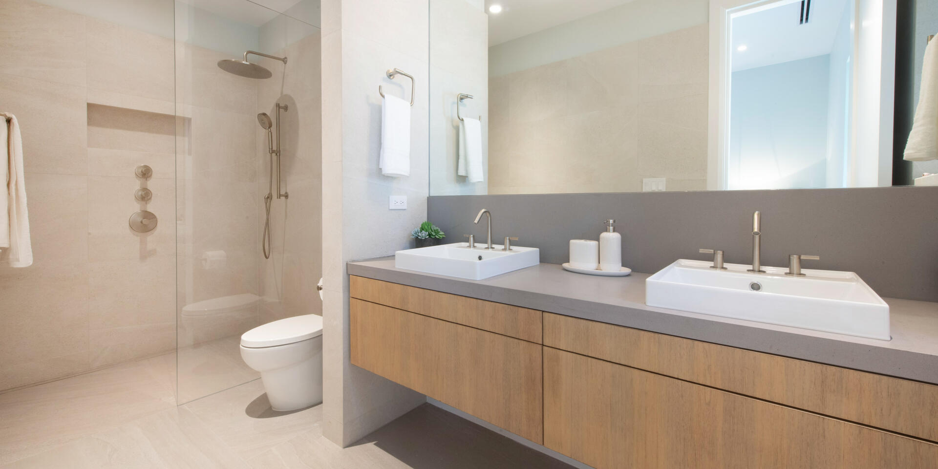 Bedroom 2 ensuite with dual vanity and zero entry shower. 