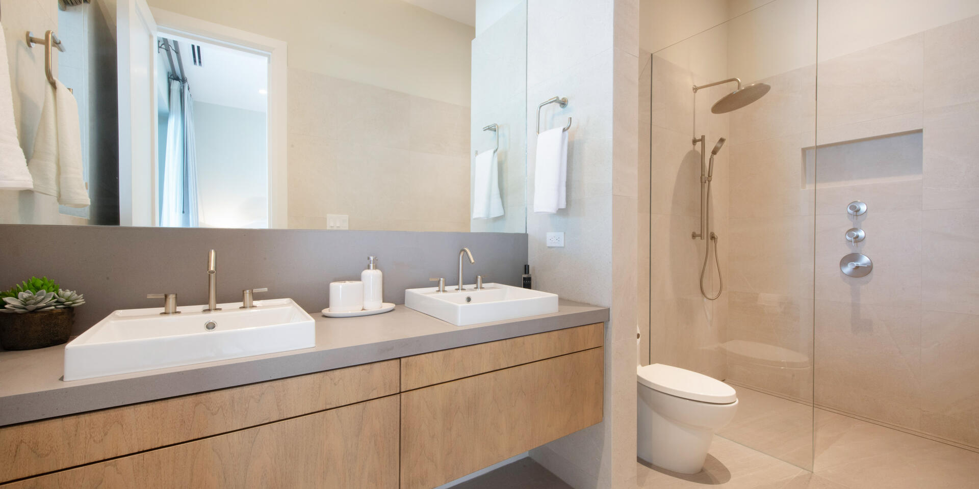 Bedroom 4 ensuite with dual vanity and shower. 