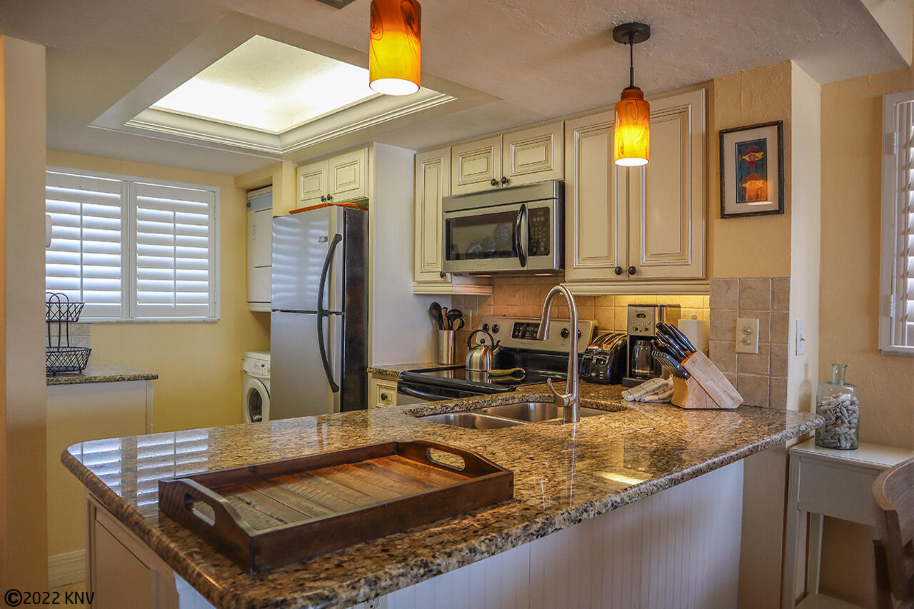 Kitchen comes with all appliances, dishware and cookware.
