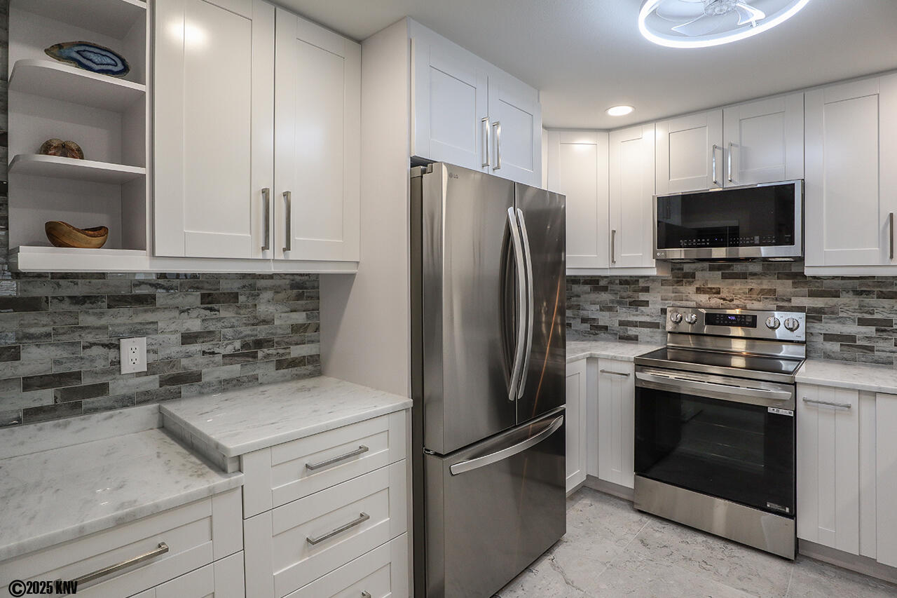 Large Kitchen enjoys marble countertops, new appliances and comes fully equipped with cookware and tableware