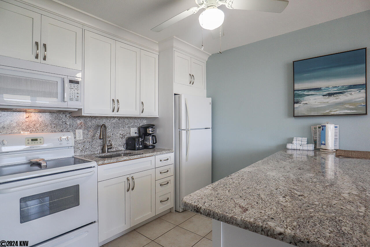 Fully Equipped Kitchen with sparkling granite countertops and new appliances