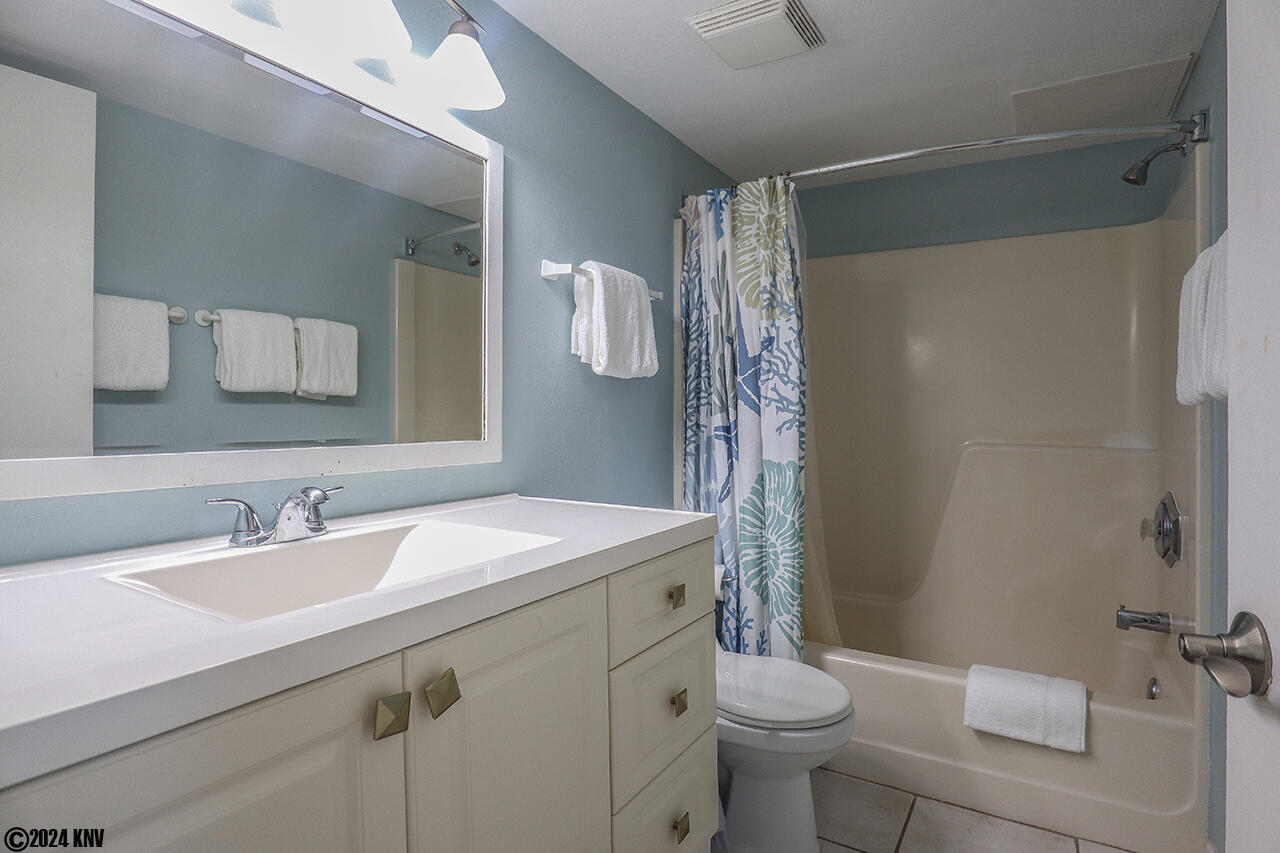Full Bath has a large vanity and tub/shower combo