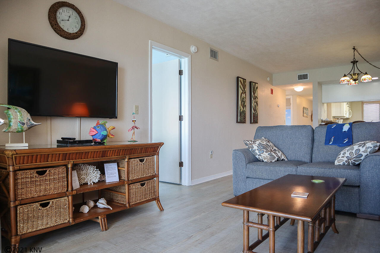 Large flat screen TV and comfortable seating in living area