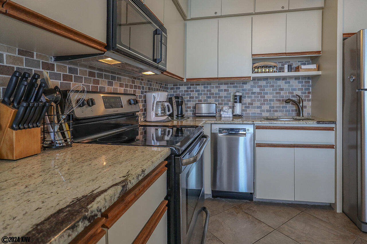 Granite countertops and a brand new Bosch dishwasher steel appliances, including a 