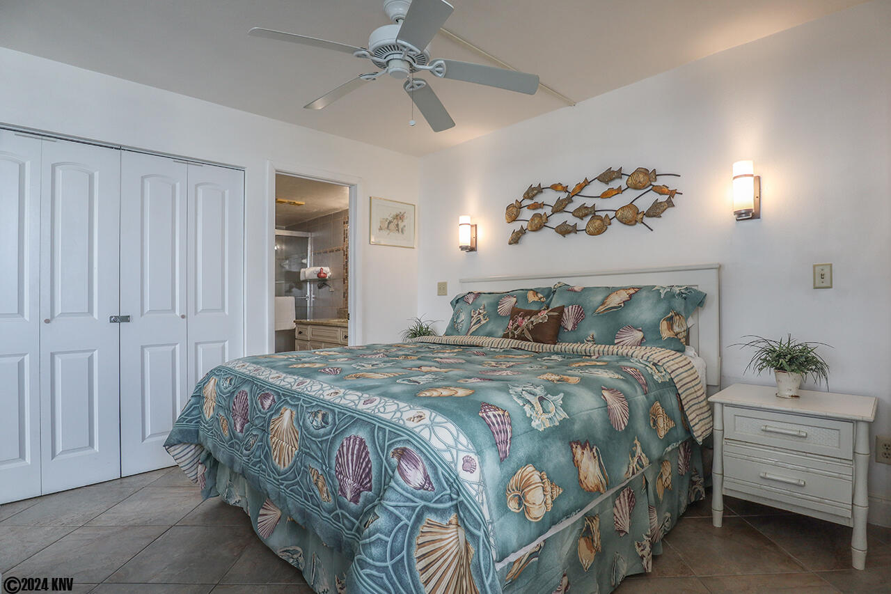 Lovely Bedroom has King Sized Bed with fresh linens, ceiling fan and its own TV