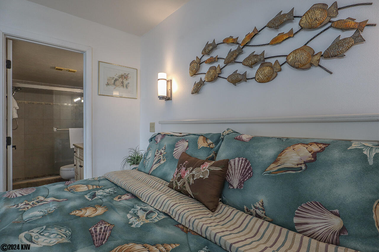 Designer linens cover the King Sized Bed in Estero Beach And Tennis Club 707C