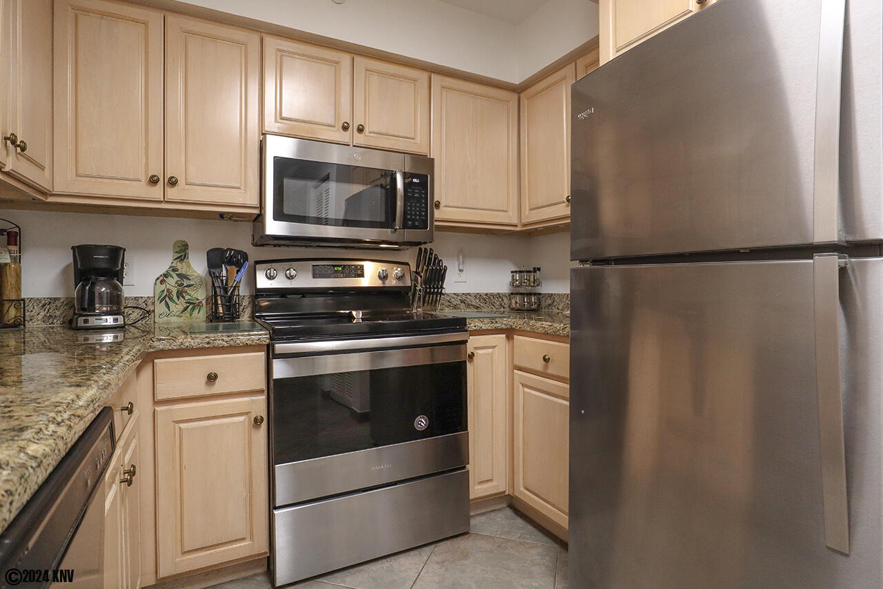 Newly remodeled Kitchen has beautiful cabinetry, new appliances and granite countertops.