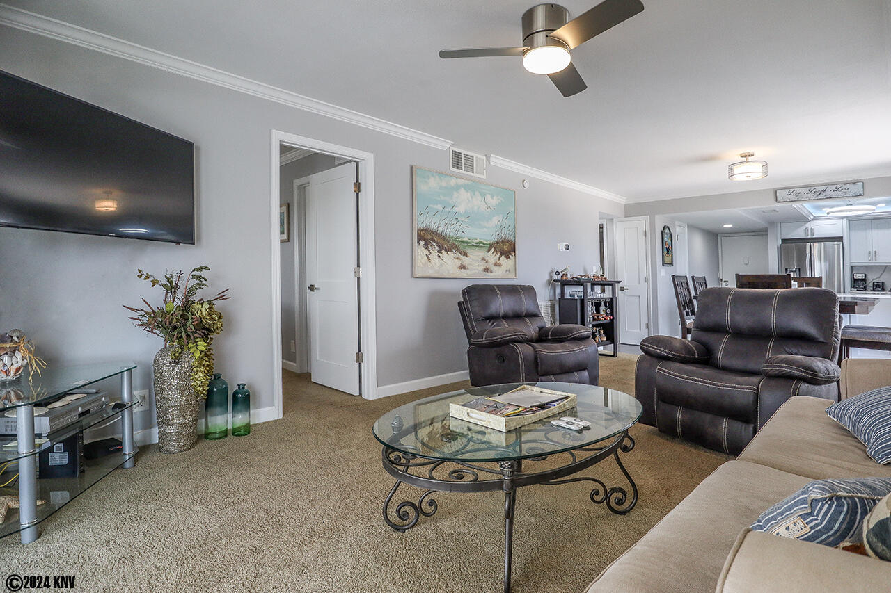Wall mounted TV and comfortable furniture means everyone gets to enjoy their favorite program.