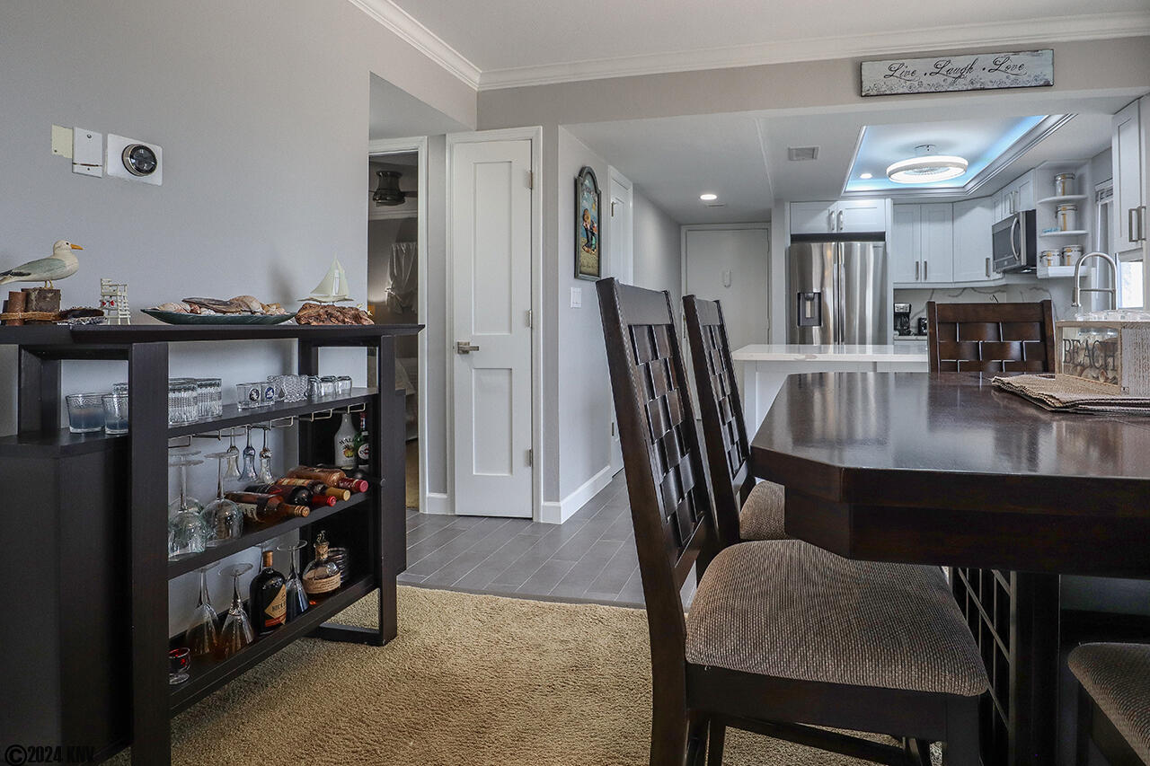 Dining Area has a lovely Table for Six and a Bar for entertaining