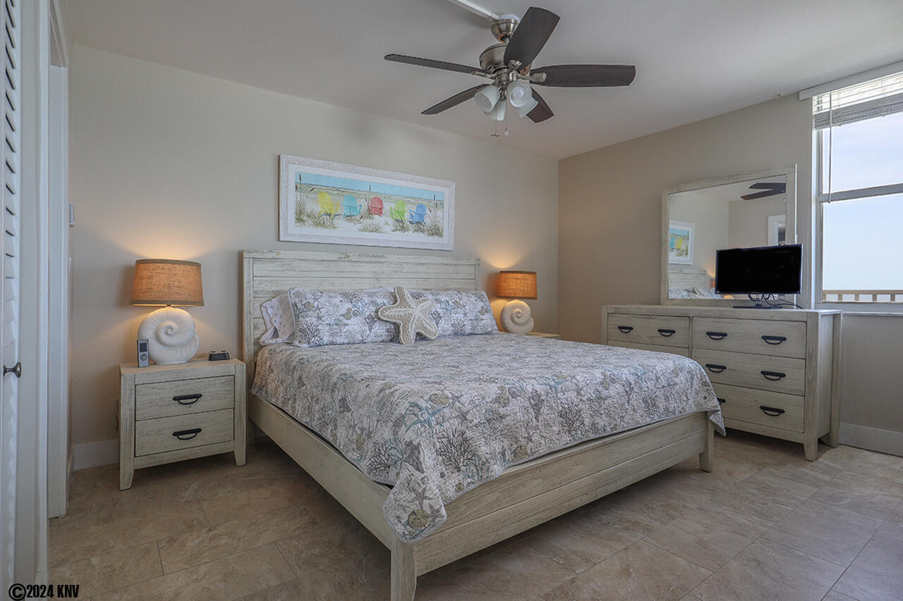 King Sized Bed, Ceiling Fan and Furniture with coastal decor