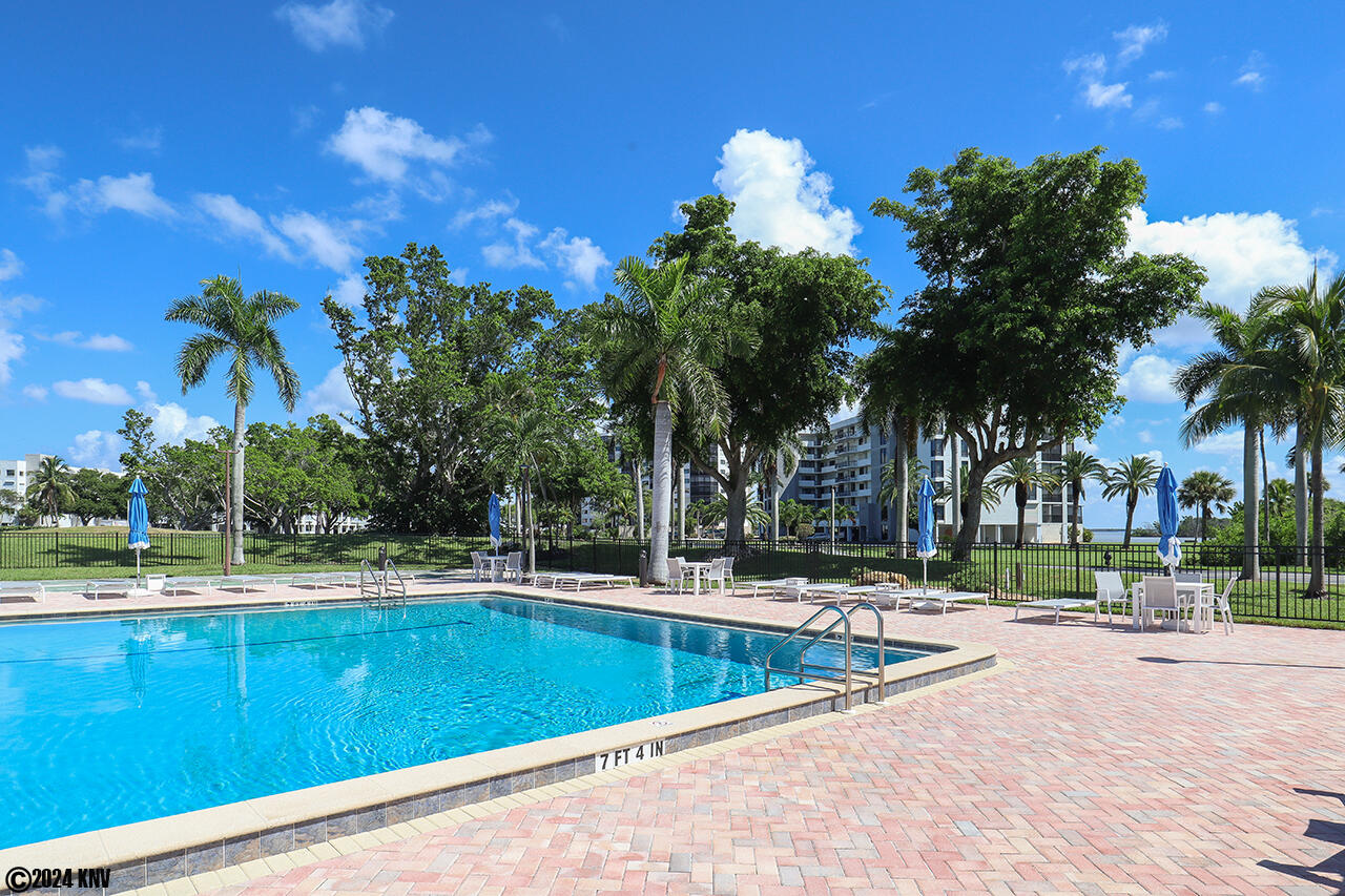 Lovely Pool and Sundeck is just across the street from The Palms Condominiums