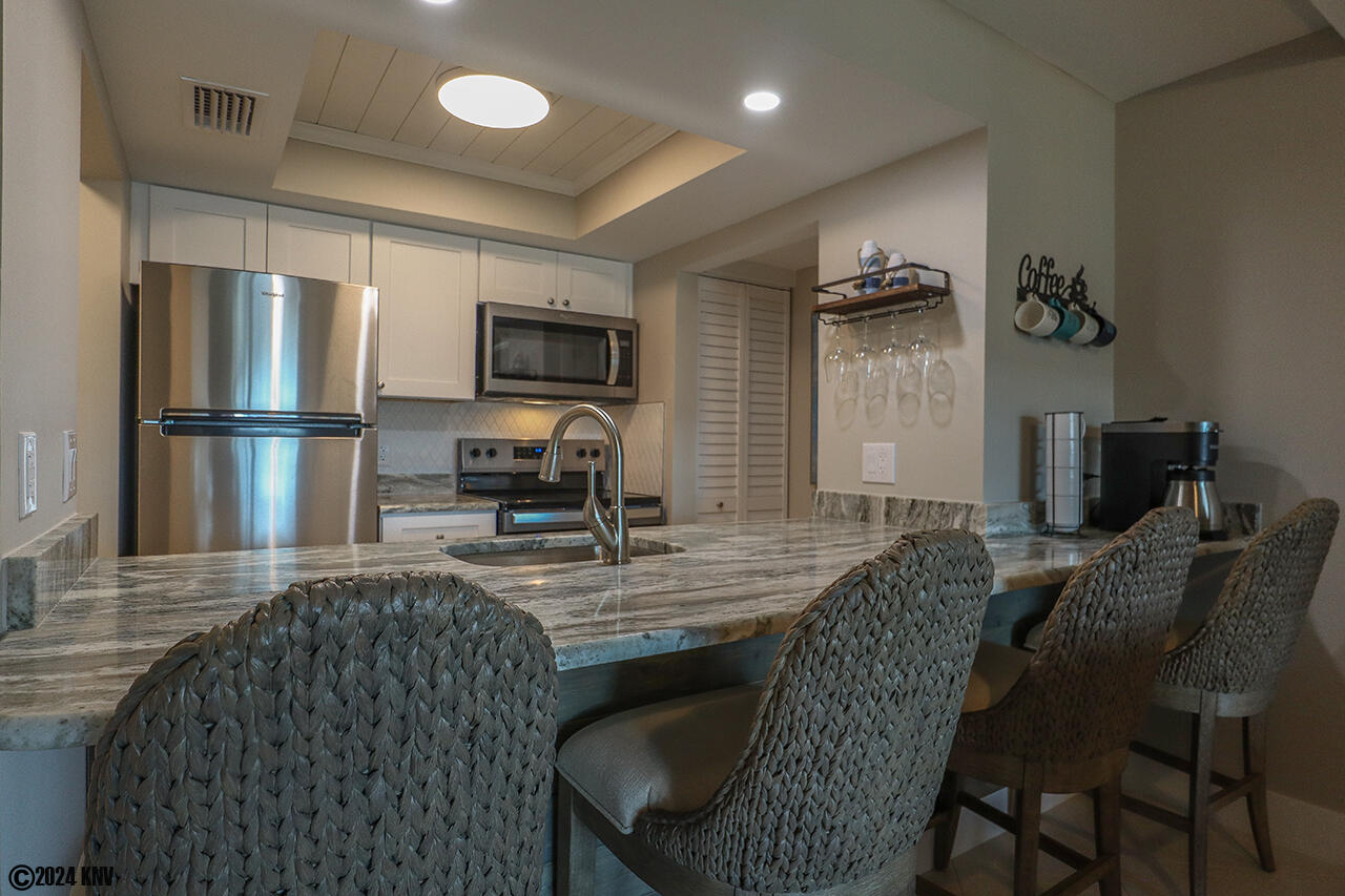 Fully Equipped and Beautifully Remodeled, the Kitchen features granite countertops and brand new appliances
