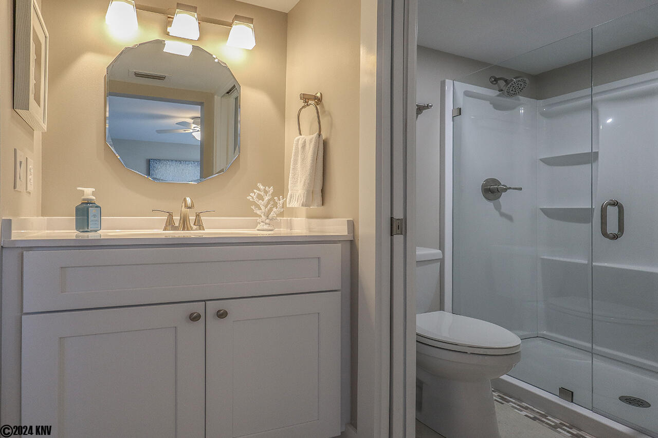 En Suite Bath has been beautifully remodeled with brand new vanity, fixtures, lighting and a Walk In Shower