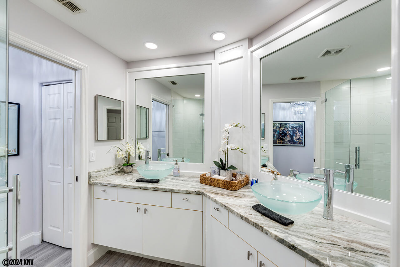 Fabulous newly remodeled Master Bath features double vanities and large Walk In Shower
