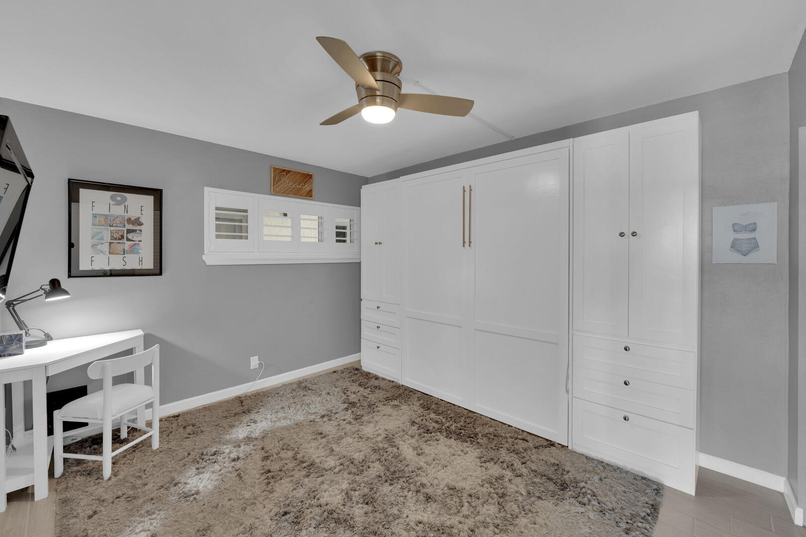 Fold up the murphy bed and use the guest bedroom as an office with a desk
