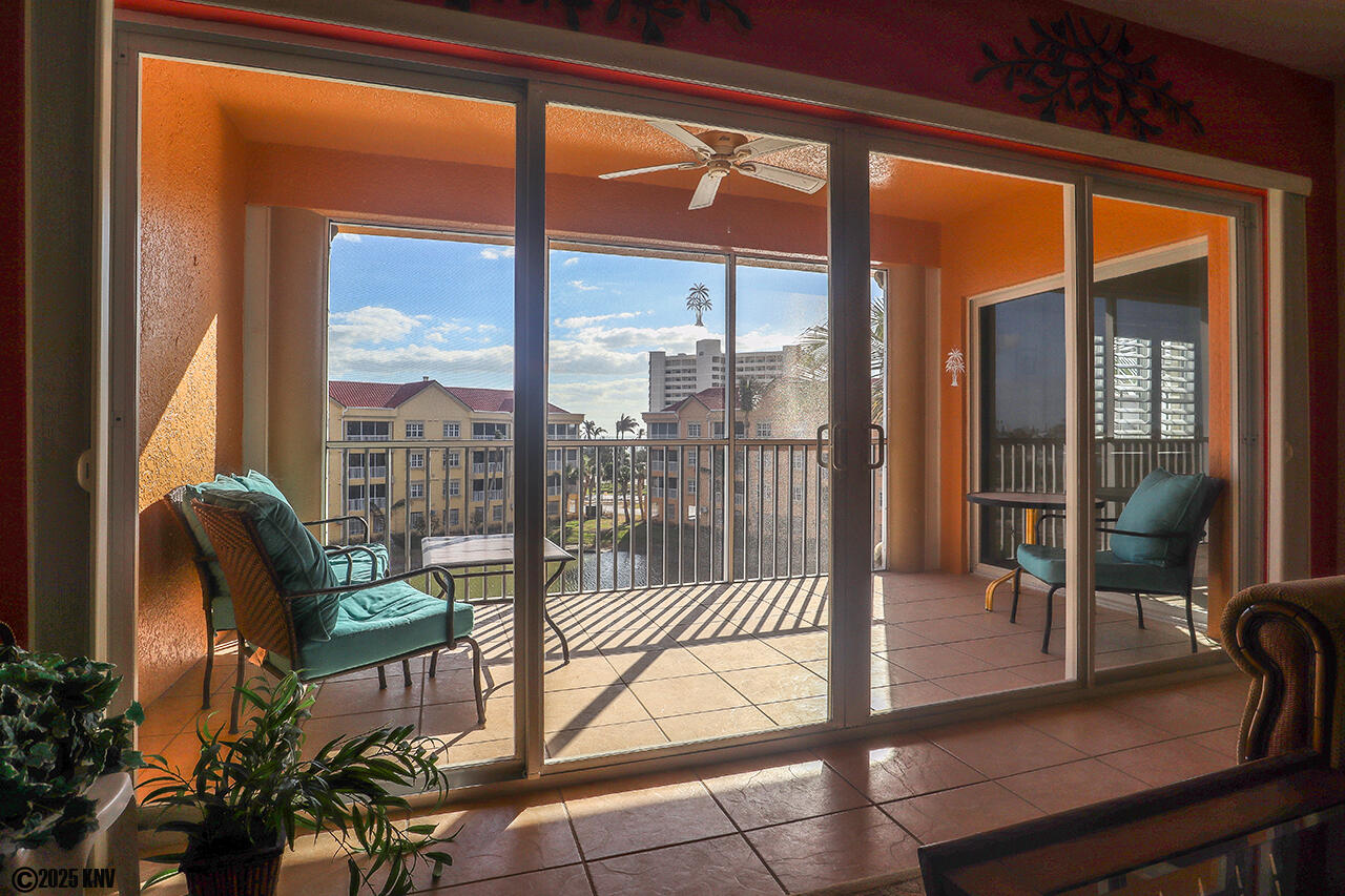 Large Glass Doors open up the living space to the Screened In Lanai