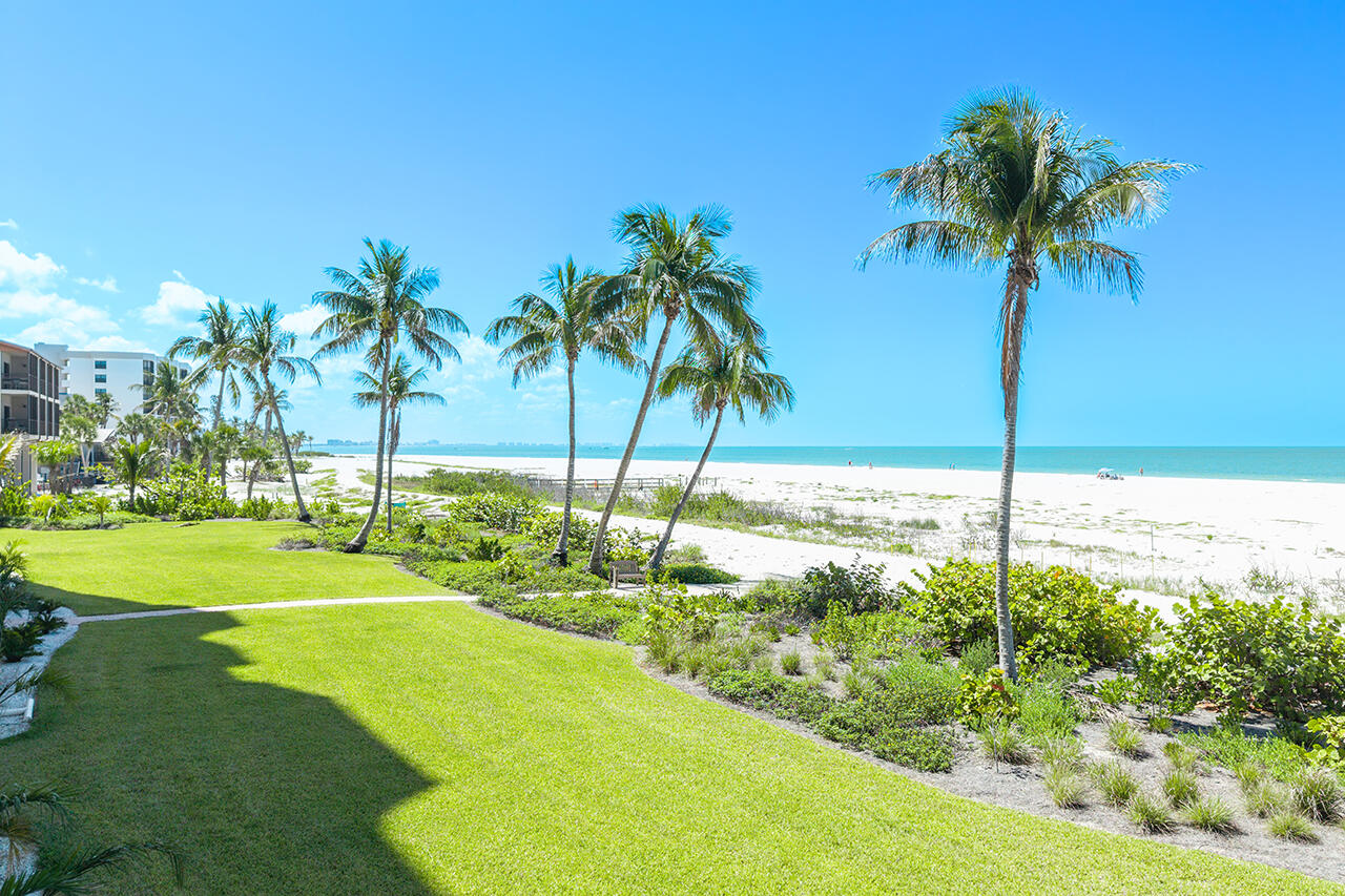 Relax on your Lanai with ceiling fan overlooking the Gulf and lush tropical landscaping.