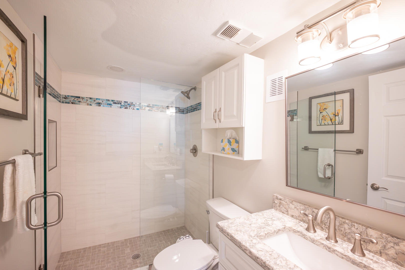 Newly Remodeled Guest Bath features a refreshing walk in shower that makes mornings feel luxurious