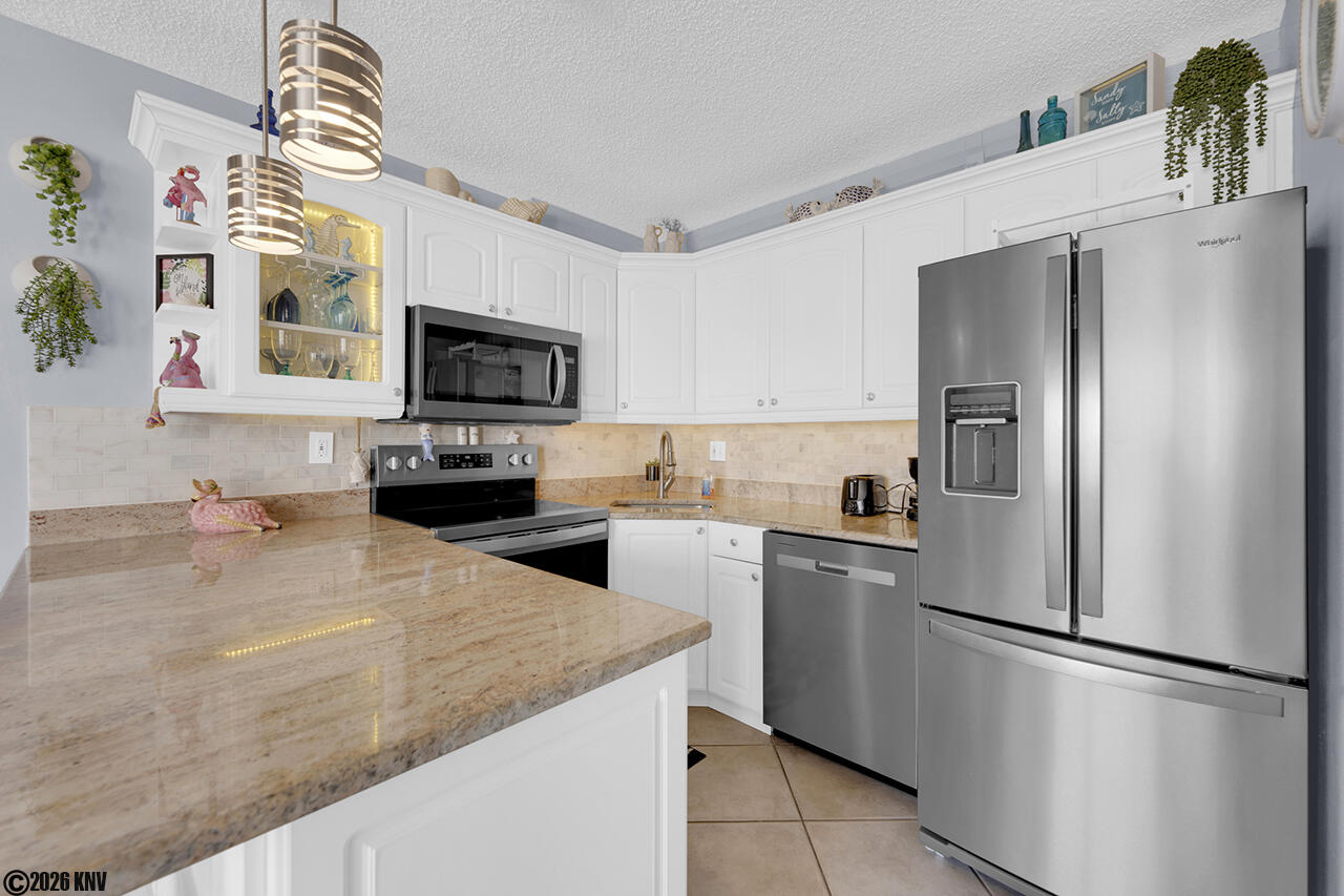 Fully equipped kitchen has all new appliances, including a dishwasher