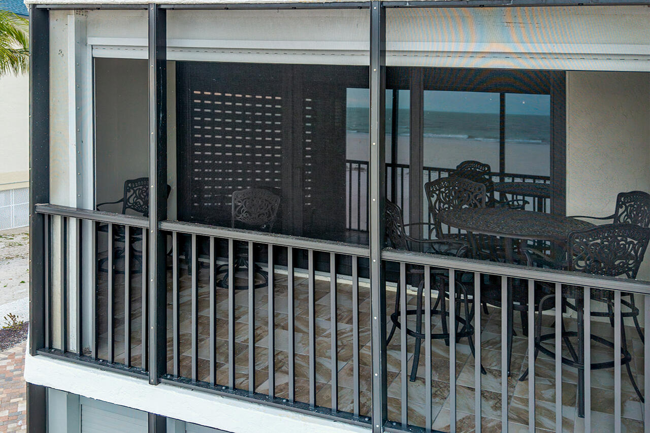 Shamron Beach Club 308's Screened In Lanai...the perfect spot to relax and take in the sea breezes.