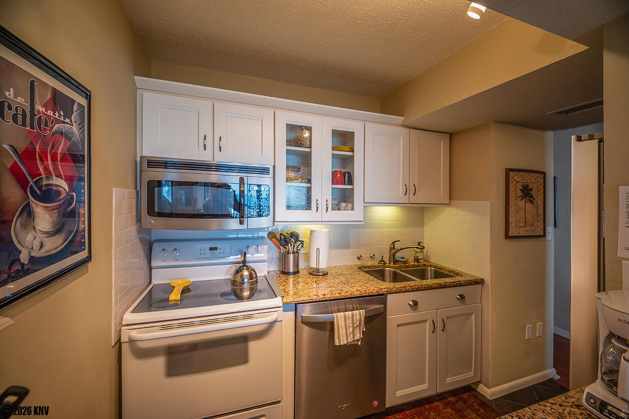 Kitchen is fully equipped and includes a dishwasher.